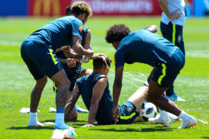 SOCHI, RUSSIA - JUNE 12:  Neymar Jr and Willian of Brazil smash eggs on Philippe Coutinho of Brazil as a birthday prank during a Brazil training session ahead of the FIFA World Cup 2018 at Yug-Sport Stadium on June 12, 2018 in Sochi, Russia.  (Photo by Buda Mendes/Getty Images)