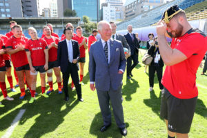 TOKYO, JAPAN - OCTOBER 23: Prince Charles, Prince of Wales presents Owen Lane (R) a cap as he visits the semi-final training venue for the Wales Rugby team at Chichibunomiya Rugby Stadium on October 23, 2019 in Tokyo, Japan. Wales will face South Africa in the semi-final on 27th October. The final will take place on 2nd November. The Prince of Wales has been Honorary Patron of the Llandovery Rugby Football club since 2009 and Patron of The London Welsh Rugby Football Club since 1985. (Photo by Chris Jackson/Getty Images)